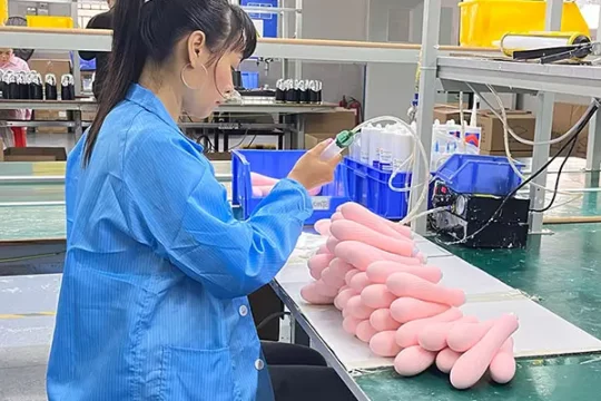 Workers are assembling the vibrators on production line 600px